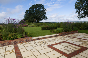 Concrete paving stone with brick detailing