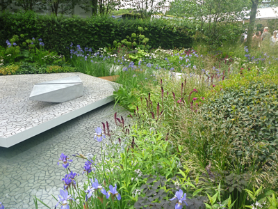 Clever cast concrete paving in Hugo Bugg's Waterscape Garden