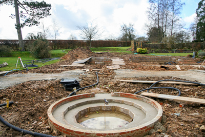 A new circular pool sits where the old swimming pool was, with a rill leading back to a raised pool