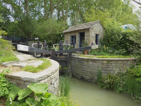 The Welcome to Yorkshire Garden with canal and lock keeper's cottage.